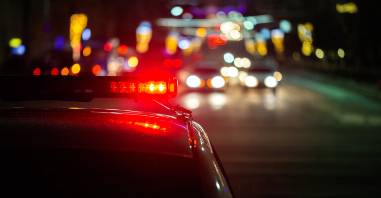 police car lights in night city with selective focus