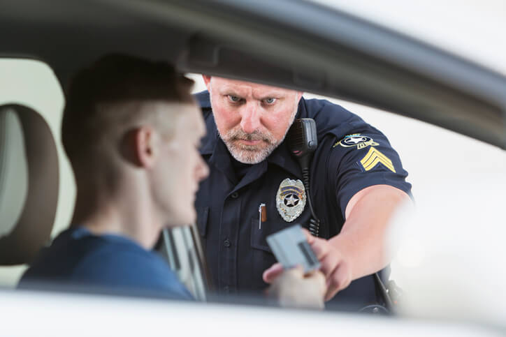 Man giving away license to officer